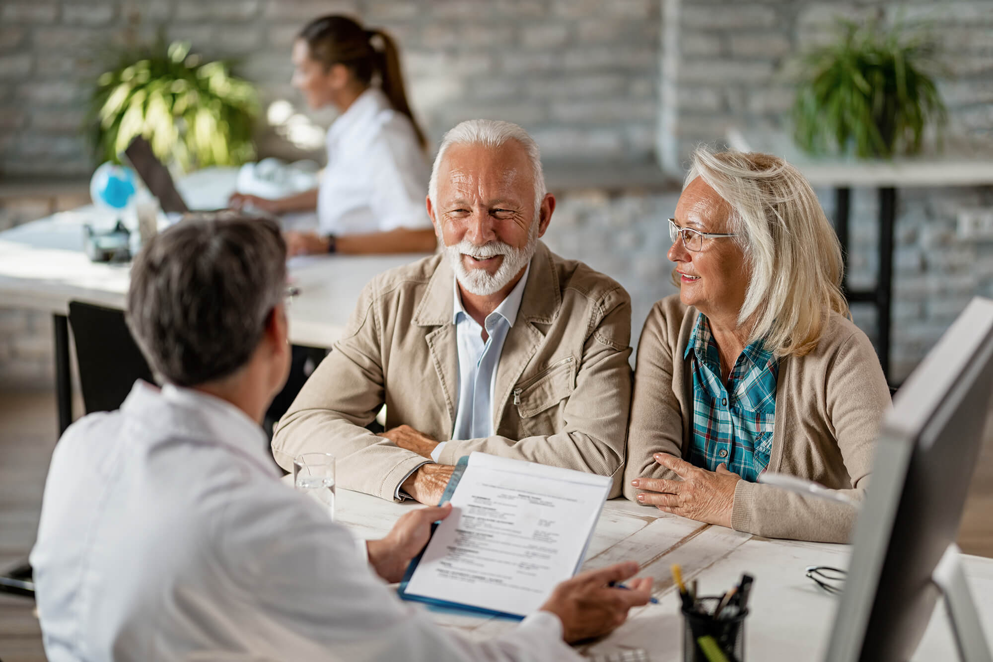 Mature couple talking to a doctor